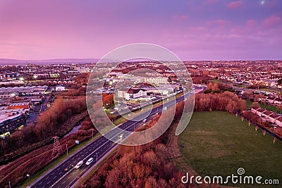 Galway, Ireland - 02.08.2023: N 6 main road at stunning sunset. Aerial drone view. Rich saturated color. Transportation and Editorial Stock Photo