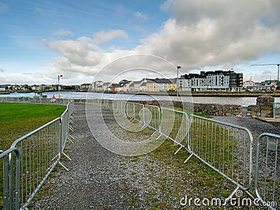 10/04/2019 Galway / Ireland: Passage made from metal security fence. Editorial Stock Photo