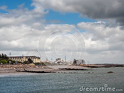 Galway / Ireland 02/20/2019 Salthill promenade, Fun fair with big wheel, cloudy sky Editorial Stock Photo
