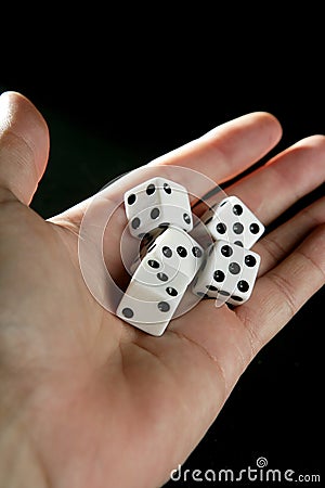 Gambler five dices in human hand Stock Photo