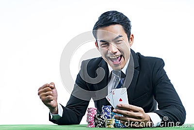 The gambler is very happy to win poker cards and recieve bet a l Stock Photo