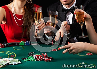 Gamblers drinking champagne Stock Photo