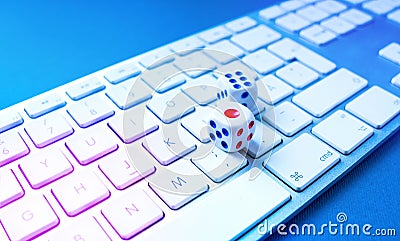 Gambling online or Casino online concept with game cubes on the keyboard Editorial Stock Photo