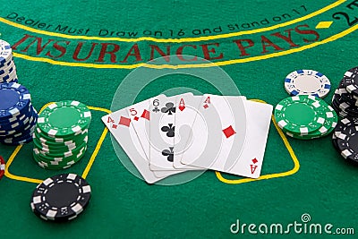 Gambling theme. Colorful casino chips on green poker table close up Stock Photo