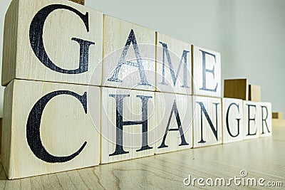 Game changer text on wooden cube blocks. Close up Stock Photo