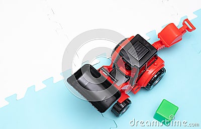 On the game mat tractor. Toys for young children. educational toys. Early development Stock Photo