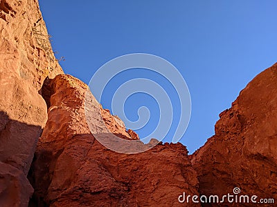 In the land of ochres, at the bottom of a natural circus Stock Photo