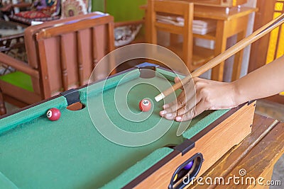 Game snooker ready for the ball shot on the green table in bar Stock Photo