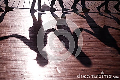 Shadows people holding hands follow each other Stock Photo