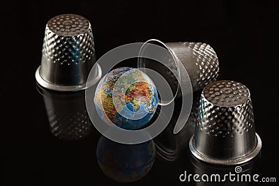 Game in a thimble with the globe Stock Photo