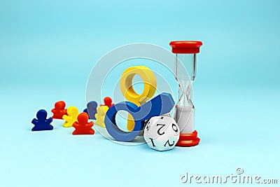 Game Time: dice, colorful figurines and hourglass. Stock Photo