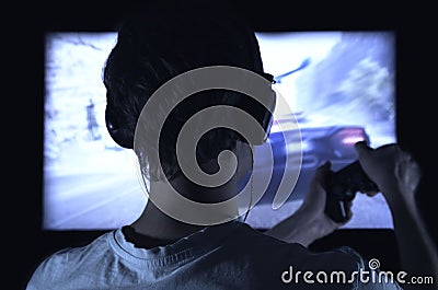 Gamer with gamepad happy to win in the online game, the player with headphones Stock Photo