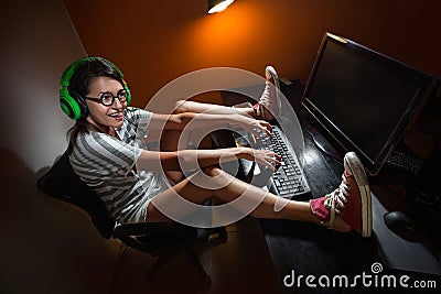 Gamer girl playing with computer Stock Photo