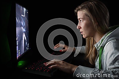 Gamer girl playing a first person shooter Stock Photo