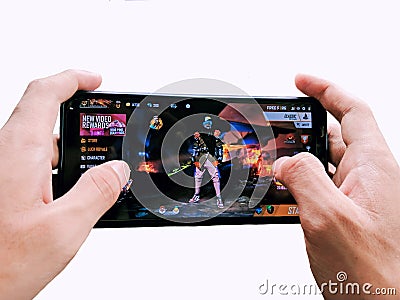 Gamer hand holding a mobile Editorial Stock Photo