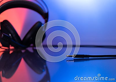 Gamer Headphones Dark Background and colorful Light. Stock Photo