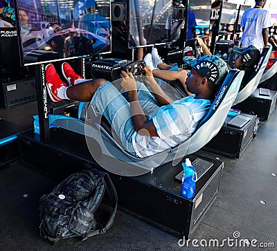 Gamers enjoy Playseat Formula E new racing simulator inside the Gaming Arena during 2019 New York City E-Prix Editorial Stock Photo