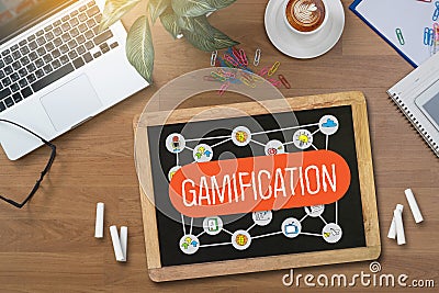 GAMIFICATION Businessman working at office desk and using computer and objects, Gamification Business Concept Stock Photo