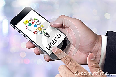 GAMIFICATION Businessman working at office desk and using computer and objects, Gamification Business Concept Stock Photo