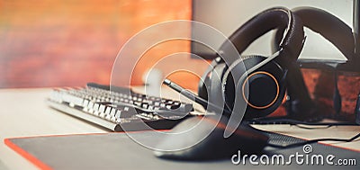 Gaming arena background with mouse gear headphones computer, focuse on headphones selected focuse long banner Stock Photo