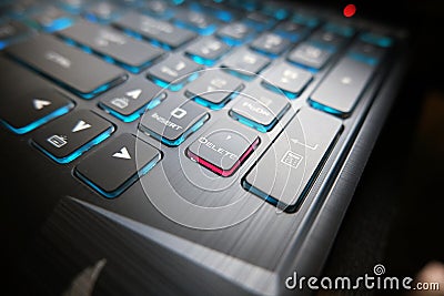 The gaming keyboard shines with multi-colored keys ,delete button in center Stock Photo