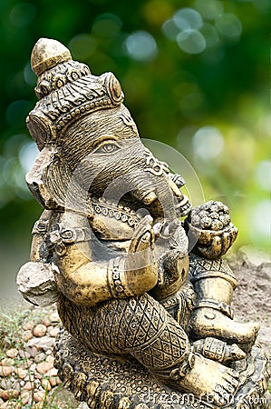 Ganesha Statue on Green Background Stock Photo