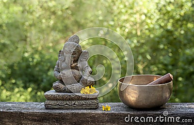 Ganesha and tibetan bowl Stock Photo