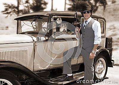 Gangster with gun and old car Stock Photo