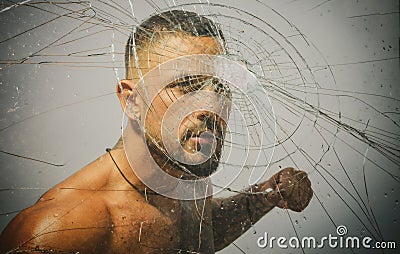 Gangster man, cracked glass. Ready to fight. Man boxing, strength and power. Hispanic gang man, south american latin Stock Photo