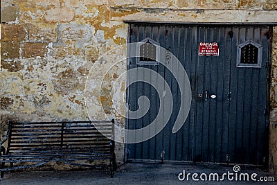 Garage and a bench tilted Stock Photo