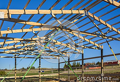 Garage construction in suburbia, USA. Closeup. Roof view. Wood, wooden roof truss system. Suburban building. Stock Photo