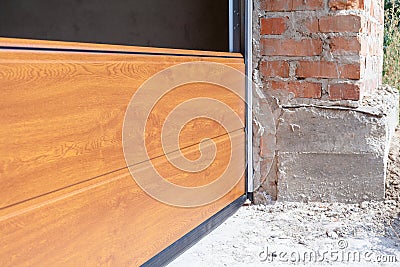 Garage doors installation.Close up of sectional panels in metal profil. Stock Photo