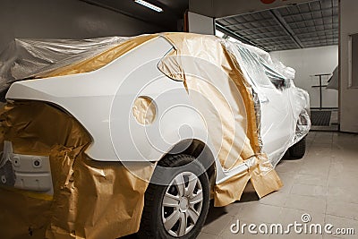 Garage painting car service. vehicle cover with protective paper before painting. Stock Photo