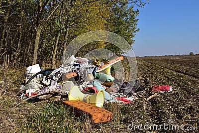 Garbage in the arable land. Stock Photo