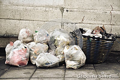 Garbage bags from household wet food trash, Waste separation management problem in urban. Stock Photo