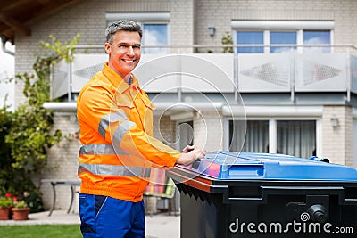 Garbage Bin Collection. Waste Collector With Rubbish Stock Photo