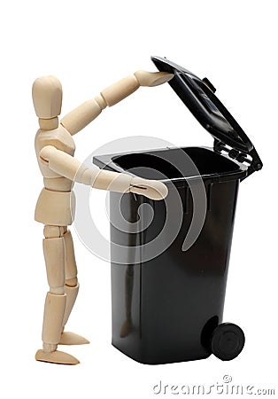 Garbage bin with wooden doll Stock Photo