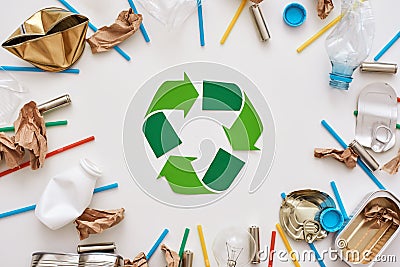 Garbage circle. Different types of garbage around the recycling symbol Stock Photo