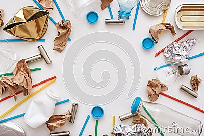 Garbage circle. Different types of unsorted garbage around the floor Stock Photo