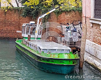 Garbage collection barge - Venice Editorial Stock Photo