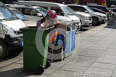 Garbage collector in China, janitor, garbage collection, garbage Editorial Stock Photo