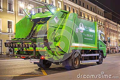 Garbage collector. An employee of the city municipal garbage. Editorial Stock Photo