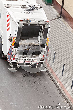 Garbage dustcart truck on city street Stock Photo