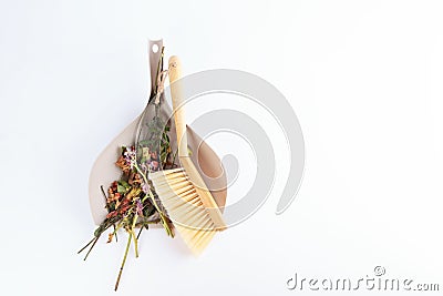 Garbage in the dustpan. Cleaning the room from garbage. Dustpan and brush on a white background. The concept of Stock Photo