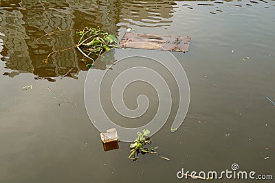 Garbage floating on the river for the concept of water pollution Stock Photo