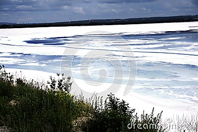 Garbage in the lake is the discharge of industrial waste poisoned the water of an industrial enterprise dirty water . Stock Photo