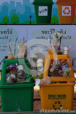 Garbage many close-up on Trash full of trash bin, Plastic bag waste Lots of junk on nature tree sunshine background. Editorial Stock Photo