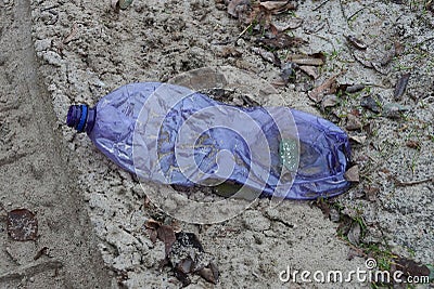 Garbage from one dirty lilac plastic bottle Stock Photo