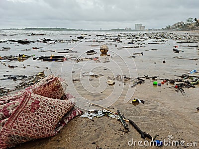 Litter on the beach washed by waves Stock Photo