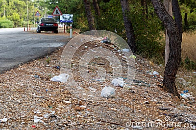Garbage thrown on the side of the highway Stock Photo